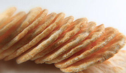 Close up of spicy yellow fried biscuits and fries