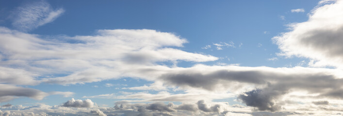 Panoramic View of Cloudscape during a cloudy blue sky sunny day. Taken on the West Coast of British Columbia, Canada.