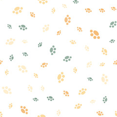 Seamless pattern with paws. Abstract pattern with blue, brown and beige paws. Random, chaotic background with cute paws.