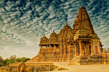 Beautiful image of Kandariya Mahadeva temple, Khajuraho, Madhyapradesh, India with blue sky and...