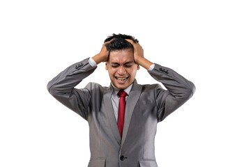stressed young businessman holding his head isolated
