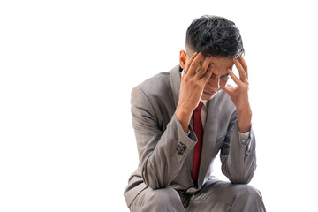 stressed businessman cover his face while sitting