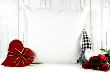 Throw pillow cushion product mockup. Valentine's Day farmhouse theme SVG craft product mockup styled with red roses, heart shaped gift, and buffalo plaid gnome against a white wood background.