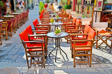 Fototapeta na wymiar talbes chairs cafe in ioannina city greece spring season