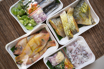 Variety of fish protein sources wrapped in polyethylene foam packaging