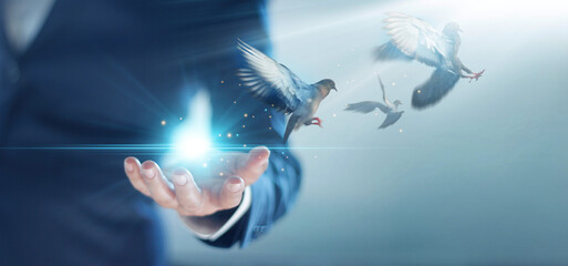Businessman and free bird enjoying nature on blue background, symbol of freedom creativity business...