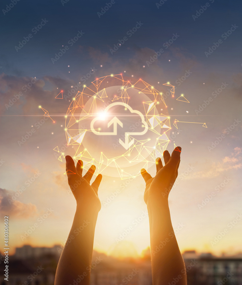 Poster Cloud computing and networking concept. Hands touching global network and cloud icon on sunset background.