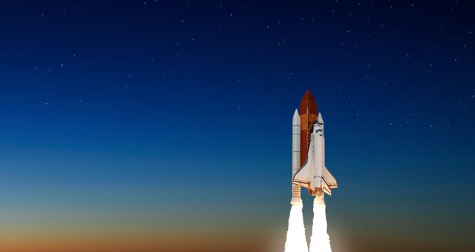 Spaceship takes off into the night sky on a mission. Rocket starts into space concept.Elements of this image furnished by NASA