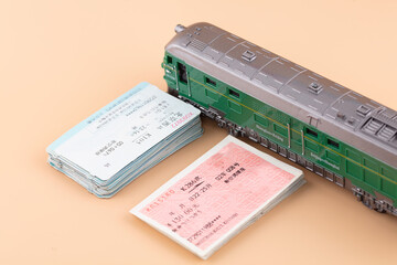 Two kinds of train tickets and the green-skinned train for the Spring Festival