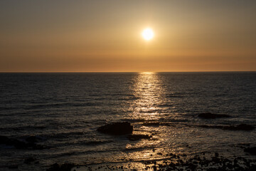 Fototapeta na wymiar 夕陽に輝く海 