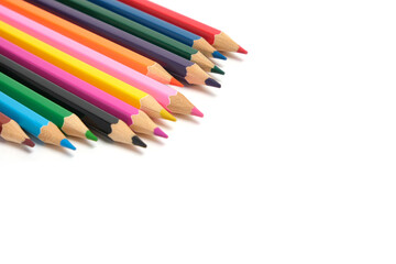 Bright colored pencils on a white background.School supplies for drawing.