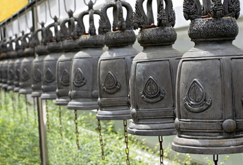 Bells old vintage many close-up In the temple Buddhism at Thailand.
