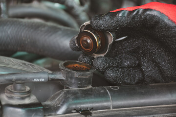 hand open the engine radiator cap to check for rust in the radiator, the radiator to leak.