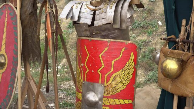 Helmet and armor, Scutum shield, Gladius sword - Roman legionary soldier metal equipment. Military of ancient Rome