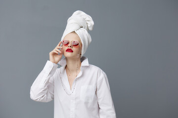 portrait of a woman red sunglasses cosmetics with towel on head Lifestyle posing