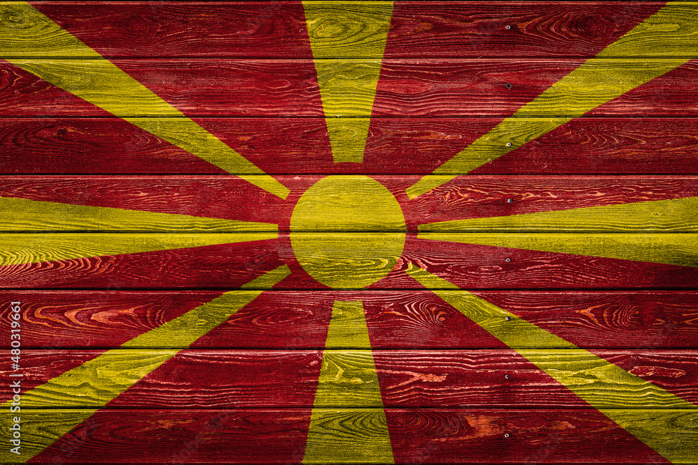 Wall mural The national flag of Macedonia. is painted on a camp of even boards nailed with a nail. The symbol of the country.