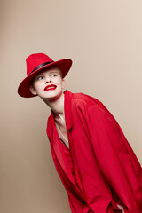 glamorous woman in a red hat and jacket makeup studio model unaltered