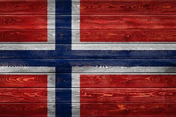 The national flag of Norway. is painted on a camp of even boards nailed with a nail. The symbol of...