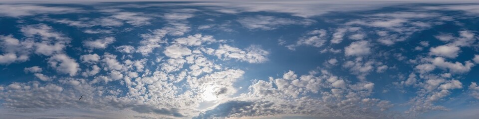 Blue sky panorama with Cirrus clouds in Seamless spherical equirectangular format. Full zenith for use in 3D graphics, game and editing aerial drone 360 degree panoramas for sky replacement.