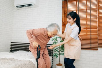 笑顔の高齢者女性と介護士の女性（訪問介護・在宅介護）