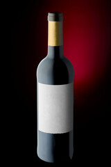 Wine bottle on black background with red backlight 