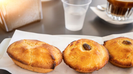 A greedy specialty of Salento, Puglia, Italy. Coffee with ice and almond syrup accompanied by another local specialty: pasticciotto, a baked confectionery product that goes perfectly with it.