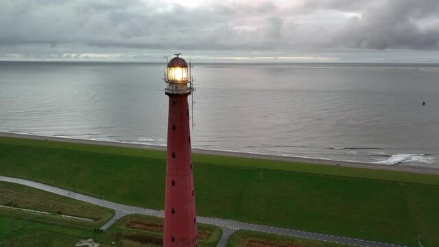 Lighthouse tower Lange Jaap in Den Helder drone aerial footage 5K along the sea near the island of Texel in North Holland, The Netherlands.