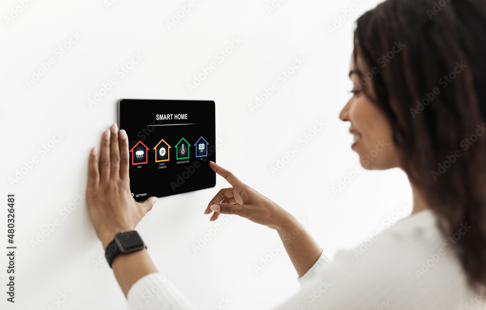 Poster black lady using smart home device, pushing button on pad