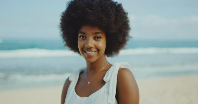 Portrait of happy young stylish successful african american black woman, relaxed morning beach lifestyle