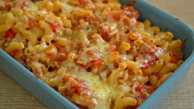 homemade baked macaroni bolognese with cheese - Italian food style