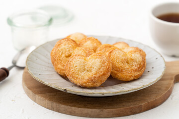 Delicious Palmier butterfly pastry in heart shape for Valentine's day dessert.