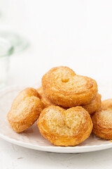Delicious Palmier butterfly pastry in heart shape for Valentine's day dessert.