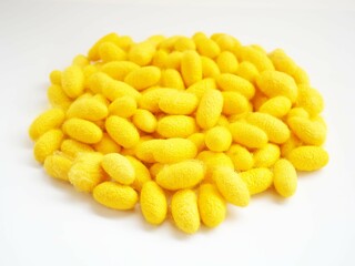 Yellow cocoon on white background. closeup photo, blurred.