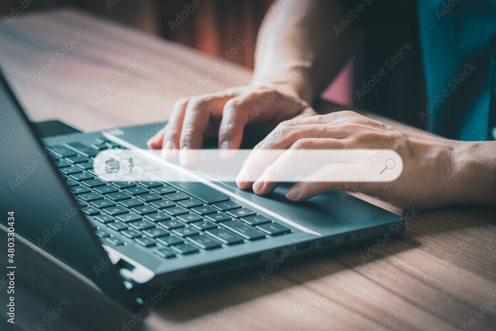 Poster Man using laptop in the room for searching browsing internet data information. Business concept for Using search with your website.