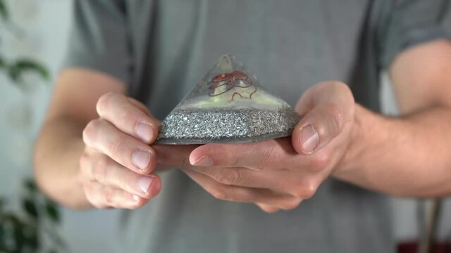 Extreme close-up of shiny orgonite pyramid
