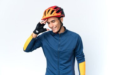 Young cyclist man isolated on background laughing