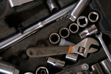 Flat lay Old hand tools in disarray  ,Pliers screwdriver wrench rusted iron metal tools on Steel plate at garage