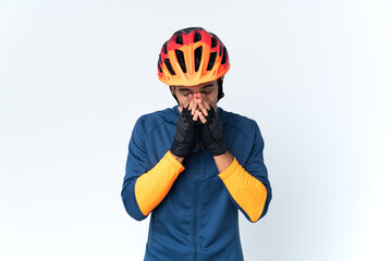 Young cyclist man isolated on background with tired and sick expression