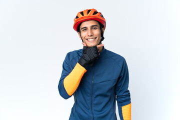 Fototapeta premium Young cyclist man isolated on background happy and smiling