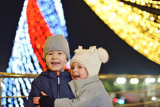  boy and girl with lights on background