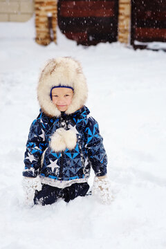 boy playing in snow