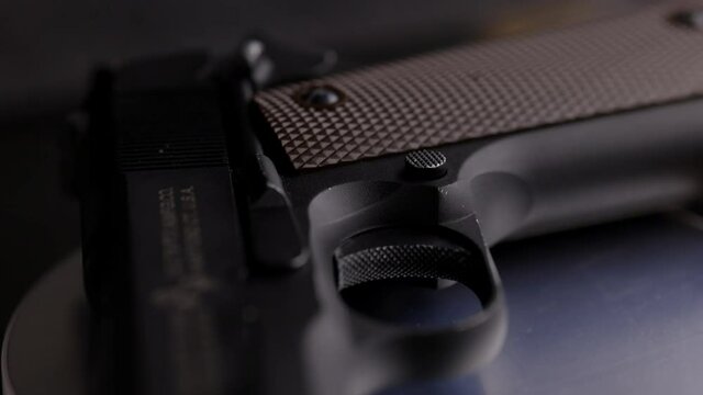 Round table close up shot of colt 45  caliber turning on table