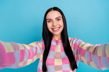 Photo of dreamy charming young woman wear pink sweater tacking selfie isolated blue color background