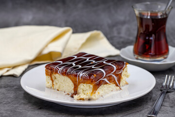 Caramel trilece dessert on dark background. Traditional Turkish cuisine flavor. close up