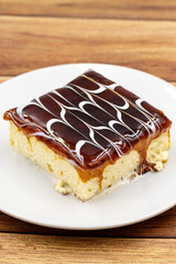 Caramel trilece dessert on wooden background. Traditional Turkish cuisine flavor. close up