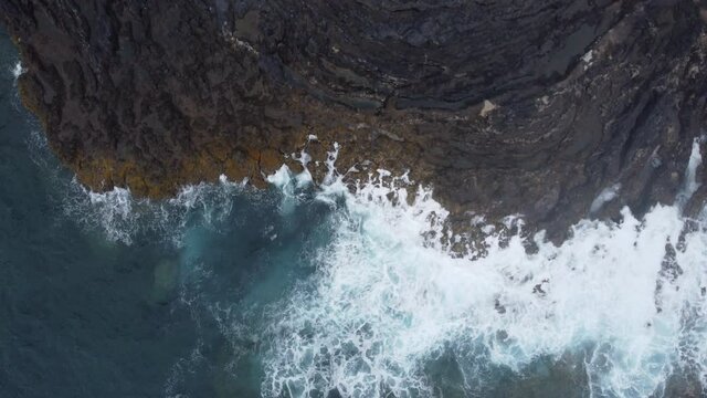 Aerial view of a rocky beach of volcanic origin washed by the sea with waves, El Hierro Island , Pozo de las Calcosas