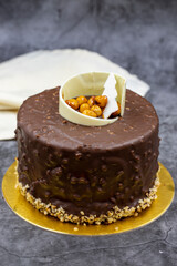 Celebratory chocolate cake on a dark background. Pastry products. close up