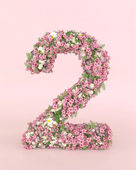 Creative number 2 concept made of fresh Spring wedding flowers. Flower font concept on pastel pink background.