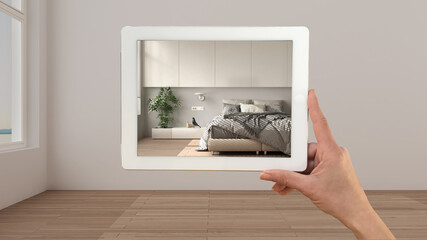 Augmented reality concept. Hand holding tablet with AR application used to simulate furniture products in custom architecture design, black ink sketch, modern bedroom with decors
