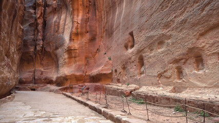 Tourist route through the gorge to Petra - Nabataean rock temple. Jordan